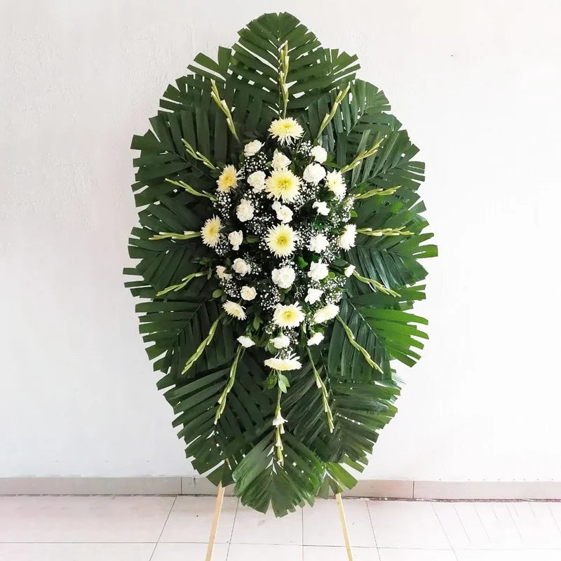 Corona de gladeolas, spaider y claveles.