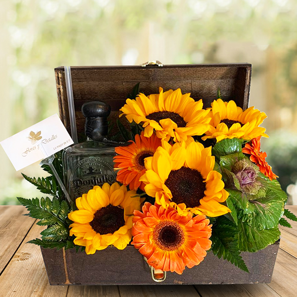 Baúl con 4 girasoles, 3 gerberas y botella