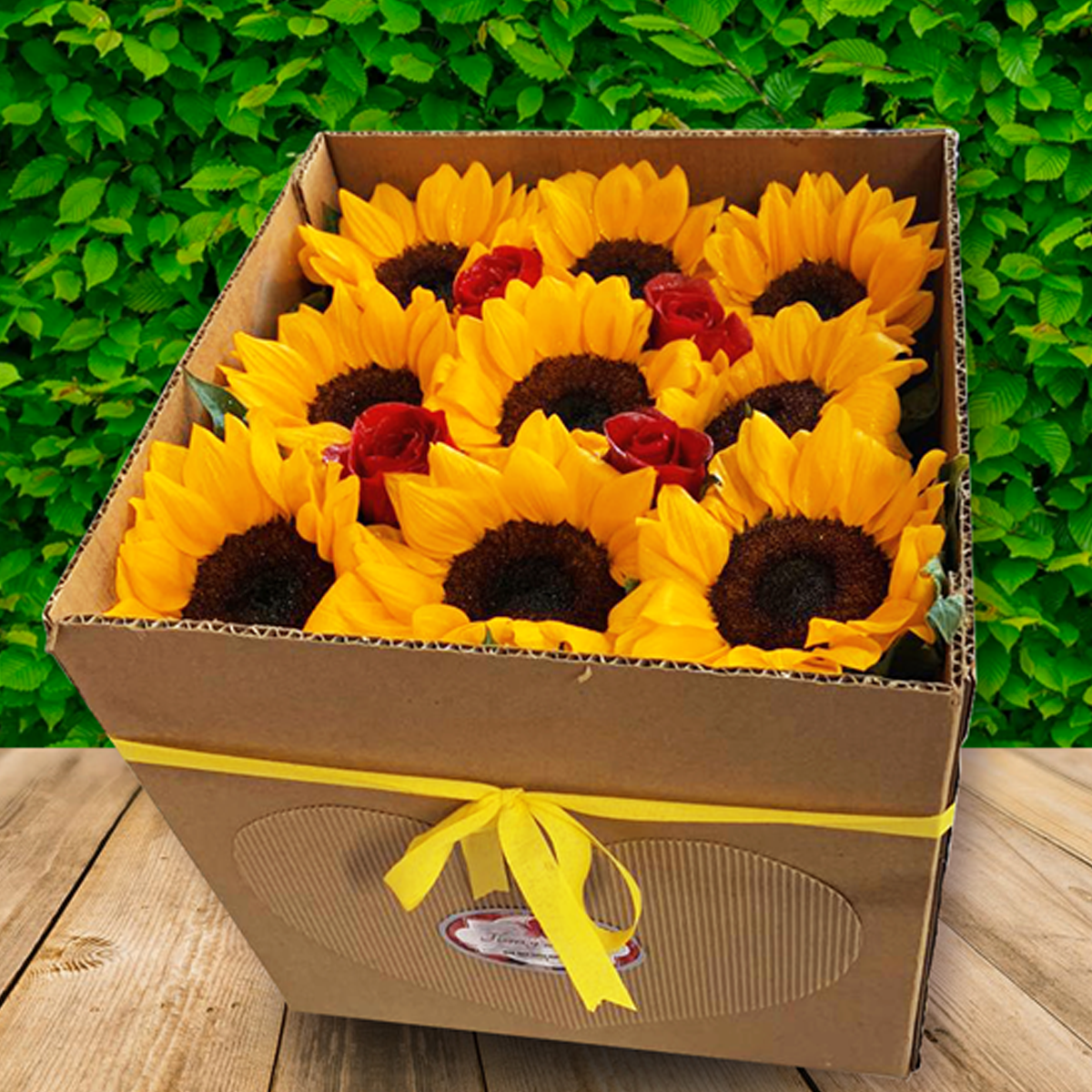 Caja sorpresa con 9 girasoles y 4 rosas